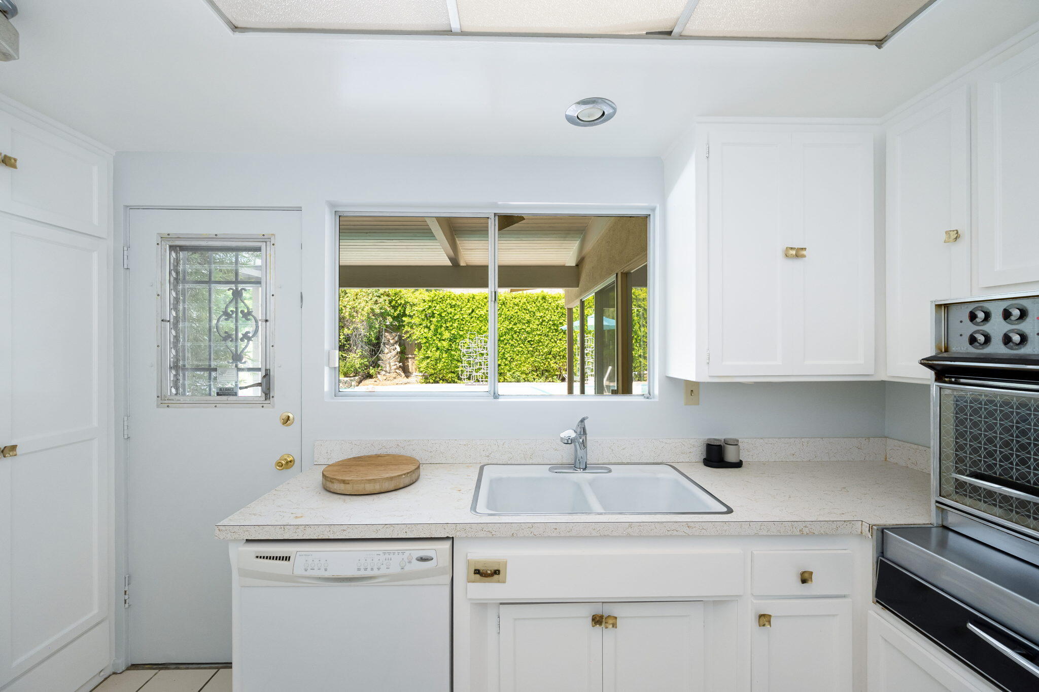 1333 East Deepwell Road Palm Springs, CA 92264 - Photo 29 of 44 a kitchen with a sink and a window