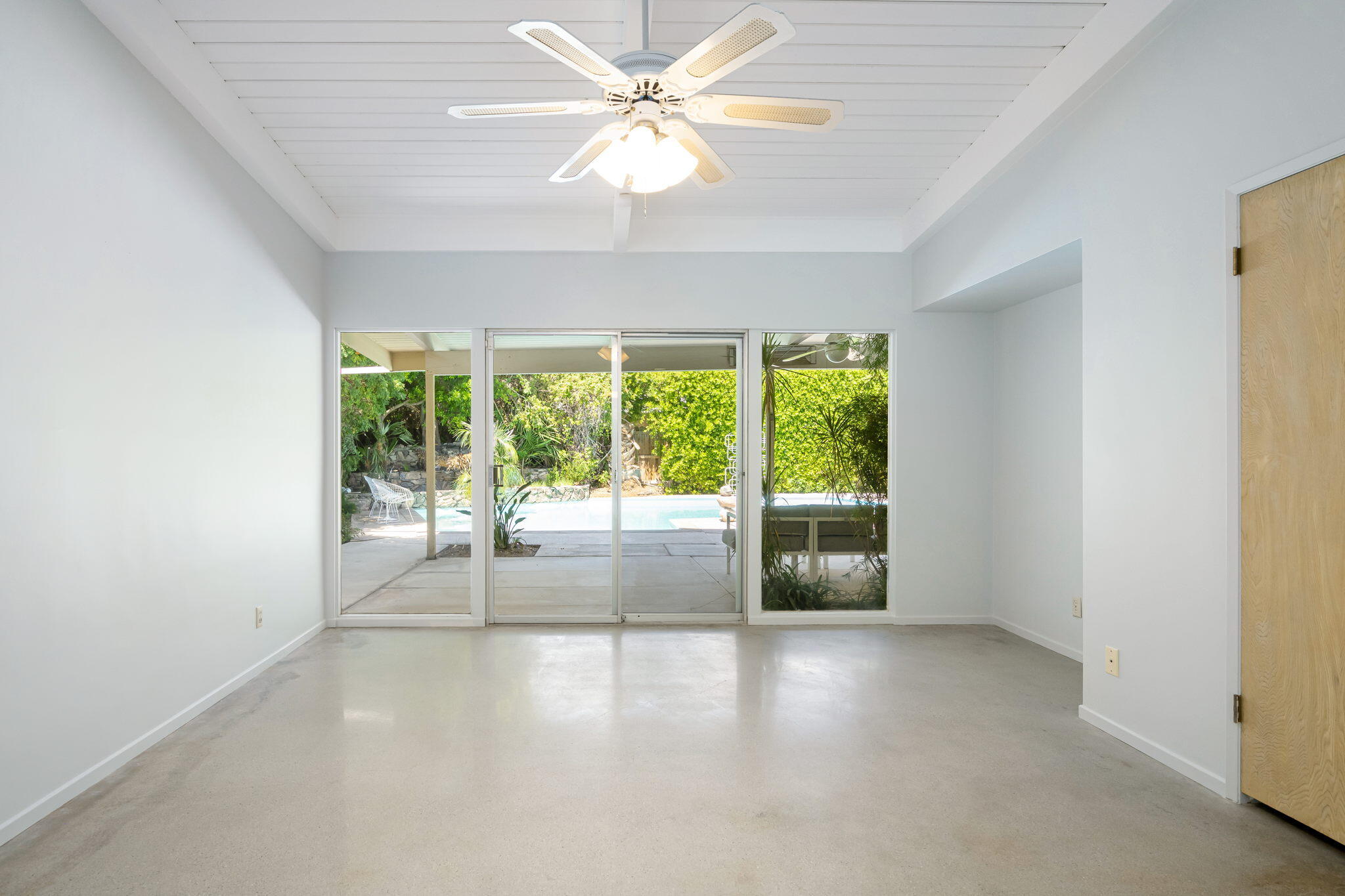 1333 East Deepwell Road Palm Springs, CA 92264 - Photo 32 of 44 an empty room with windows and outdoor view