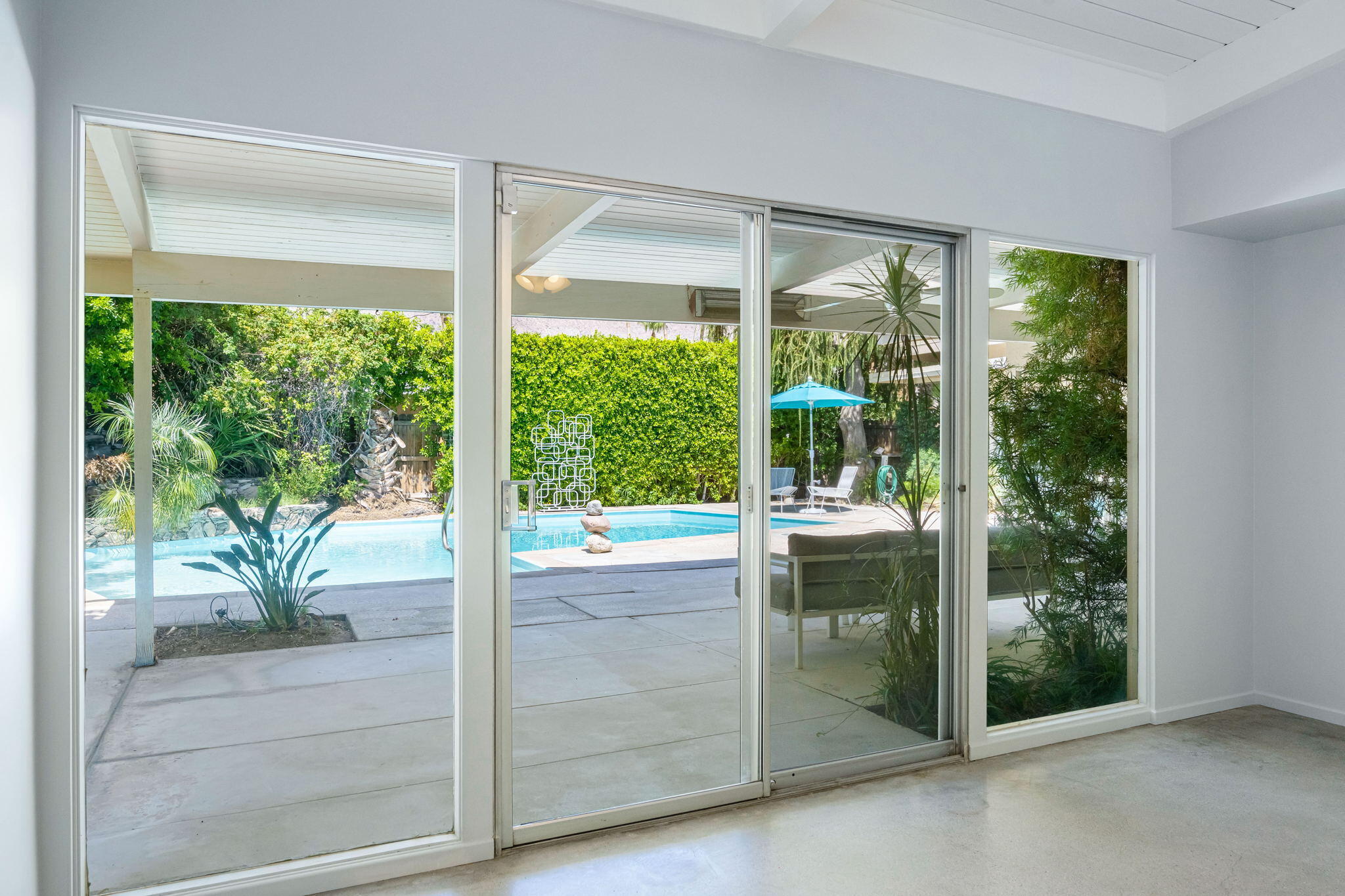 1333 East Deepwell Road Palm Springs, CA 92264 - Photo 33 of 44 a view of a room that has a large window and an outdoor view