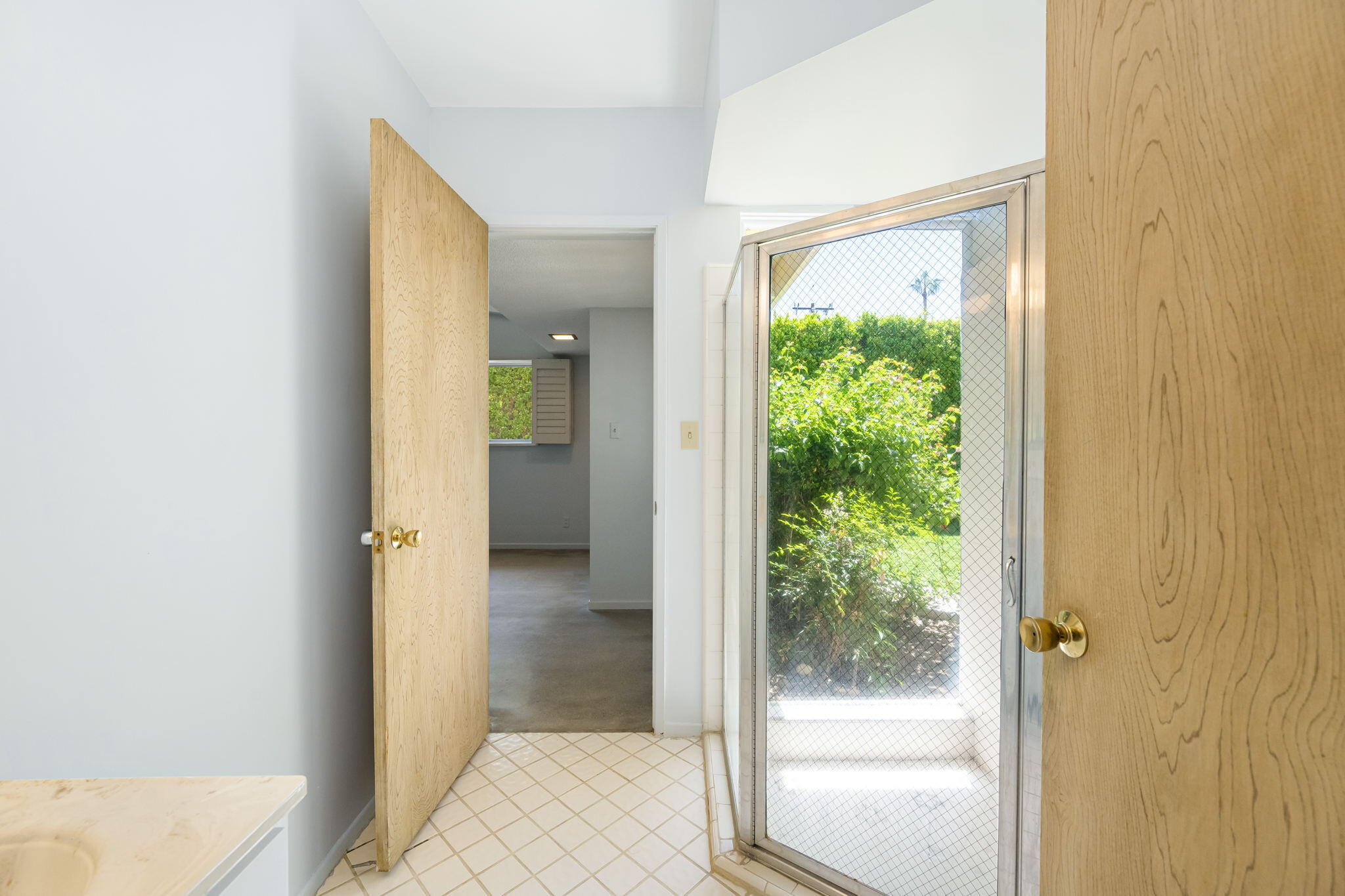 1333 East Deepwell Road Palm Springs, CA 92264 - Photo 39 of 44 a view of a bathroom from a hallway