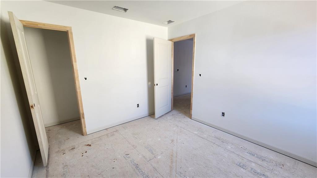 85 Silverleaf Trail Bethlehem, GA 30620 - Photo 15 of 36 an empty room with windows