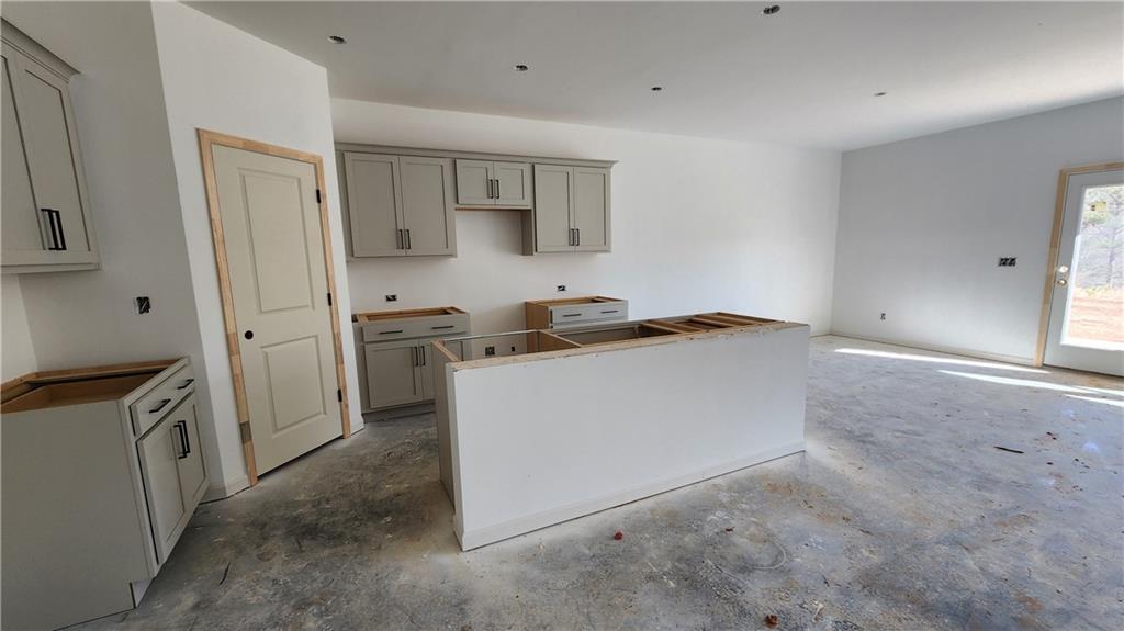 85 Silverleaf Trail Bethlehem, GA 30620 - Photo 4 of 36 a utility room with cabinets washer and dryer