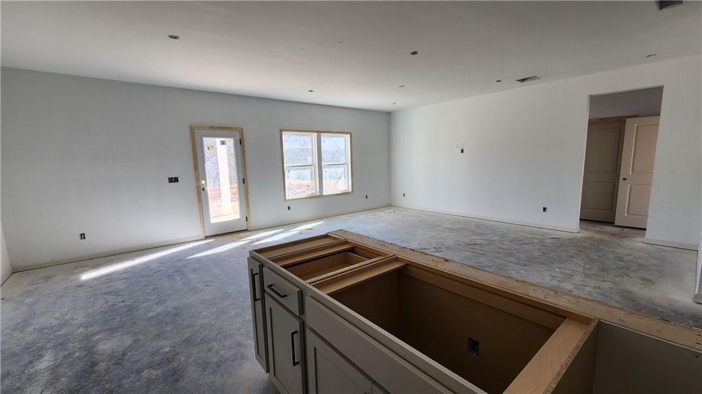 85 Silverleaf Trail Bethlehem, GA 30620 - Photo 7 of 36 a kitchen with a stove and a sink