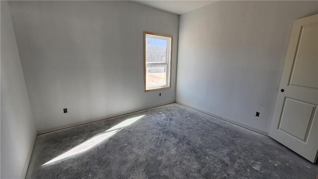 85 Silverleaf Trail Bethlehem, GA 30620 - Photo 10 of 36 an empty room with windows