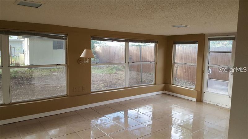 4607 Belfast Drive New Port Richey, FL 34652 - Photo 2 of 7 a view of an empty room and window