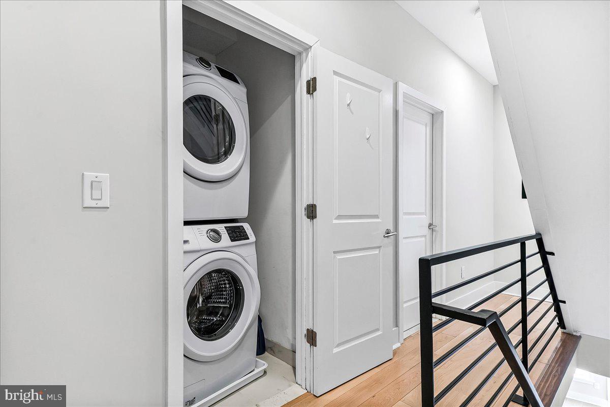 2615 East Letterly Street Philadelphia, PA 19125 - Photo 16 of 36 a view of a hallway with washer and dryer