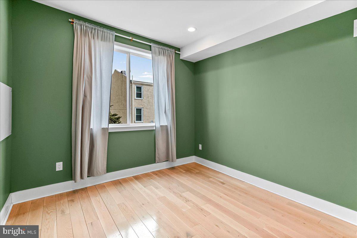 2615 East Letterly Street Philadelphia, PA 19125 - Photo 17 of 36 a bedroom with a bed and a window