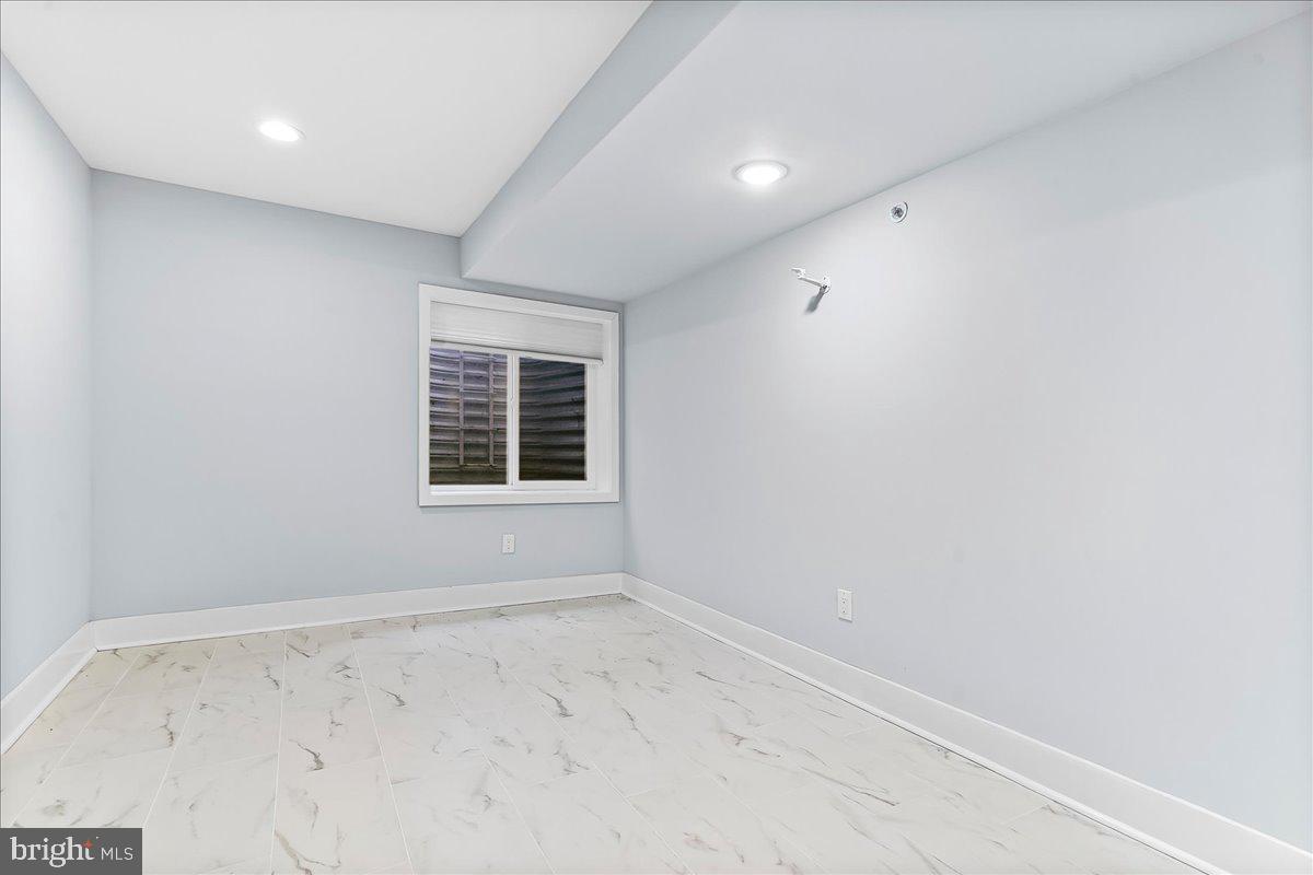 2615 East Letterly Street Philadelphia, PA 19125 - Photo 33 of 36 an empty room with a window