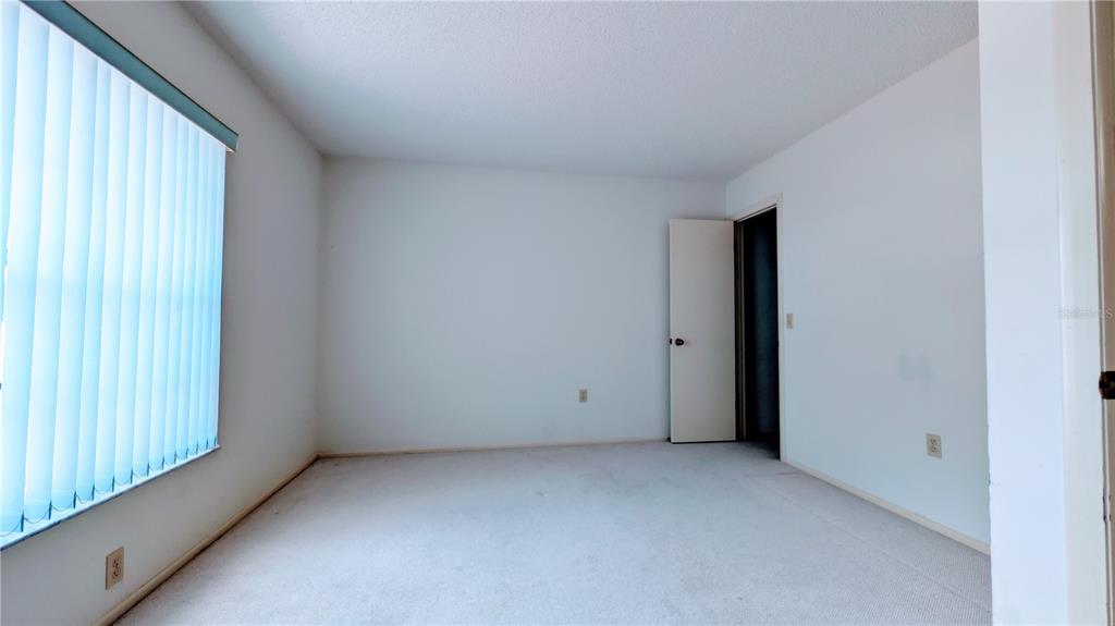 11438 Palomar Street Spring Hill, FL 34609 - Photo 21 of 37 a view of an empty room with a window