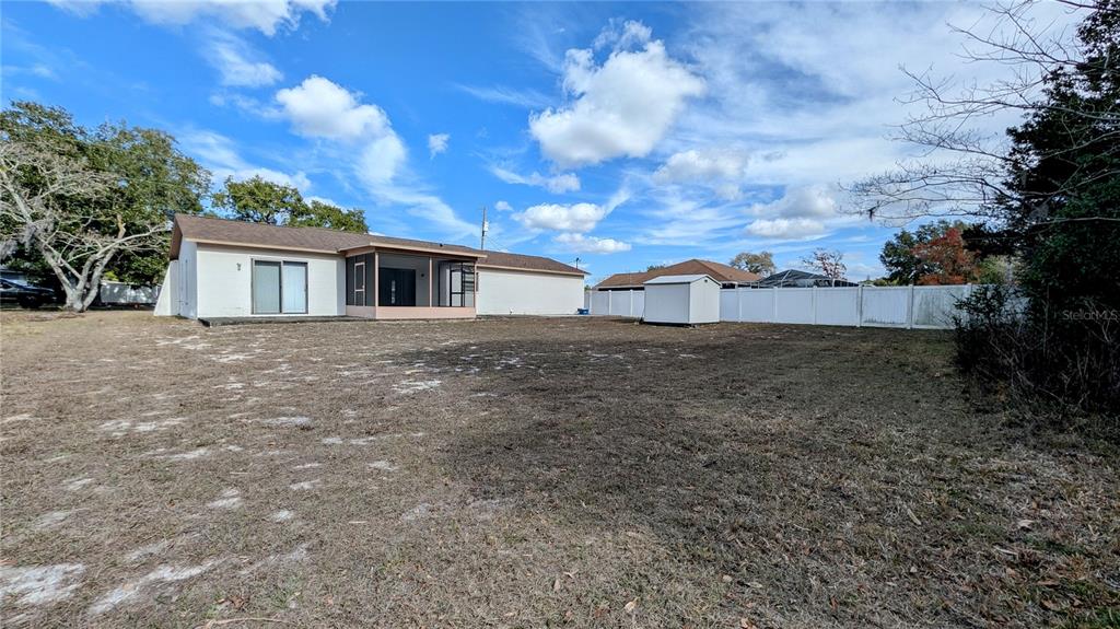 11438 Palomar Street Spring Hill, FL 34609 - Photo 35 of 37 a view of a house with a yard