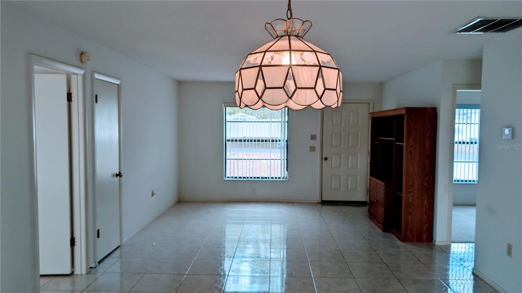 11438 Palomar Street Spring Hill, FL 34609 - Photo 5 of 37 a view of entryway with chandelier