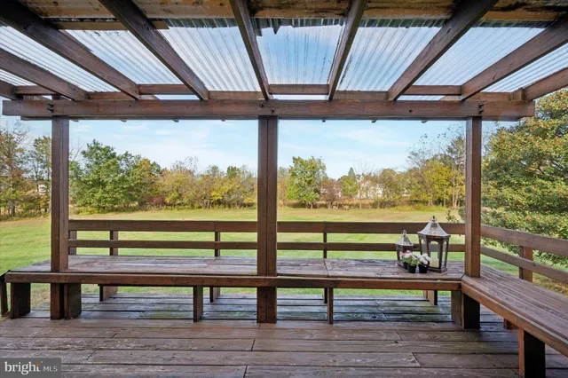 a view of sitting area with furniture and wooden floor