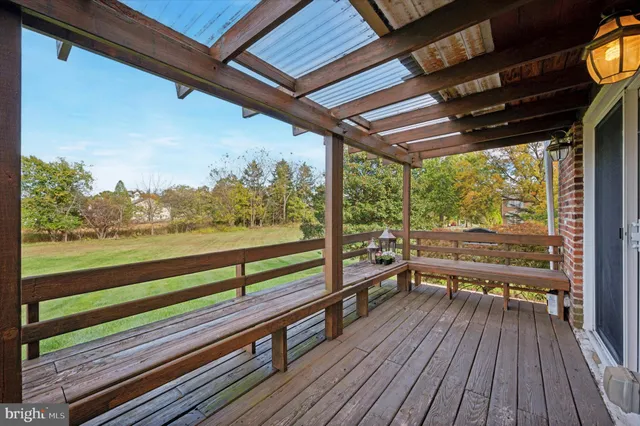 a view of two chairs in a balcony