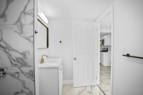 a bathroom with a sink and mirror