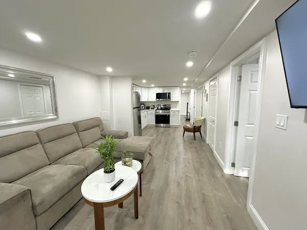 a living room with furniture and a table