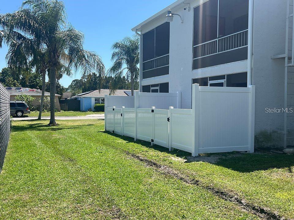 9911 Aquarius Drive, Unit 4 Port Richey, FL 34668 - Photo 16 of 26 a view of a back yard