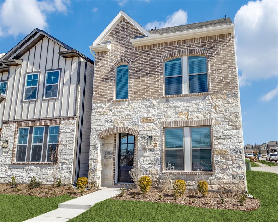 a front view of a house with yard
