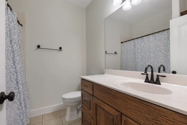 a bathroom with a sink toilet and vanity