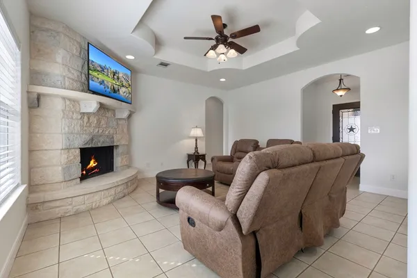 a living room with furniture and a fireplace