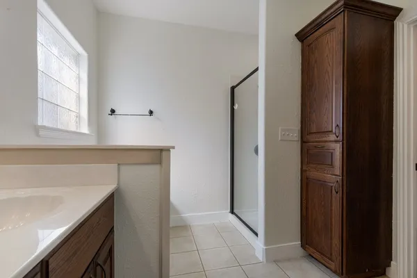 a kitchen with a sink and a refrigerator