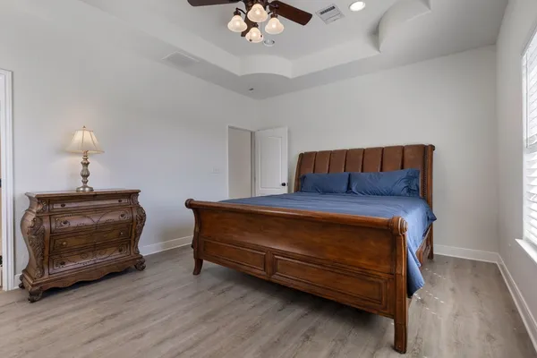 a bed room with a bed and a window