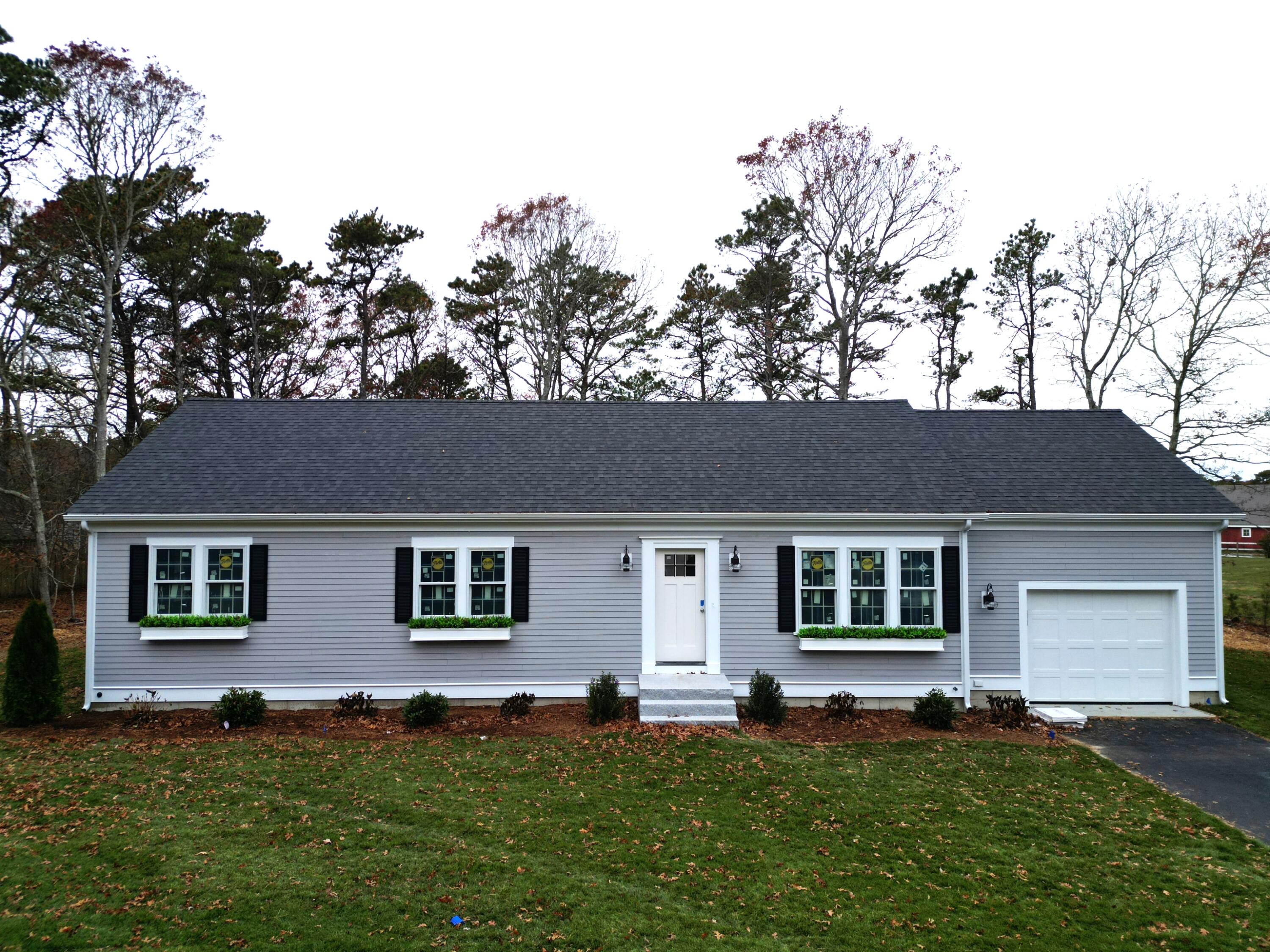 front view of a house with a yard
