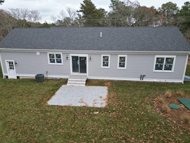 a aerial view of a house with a yard