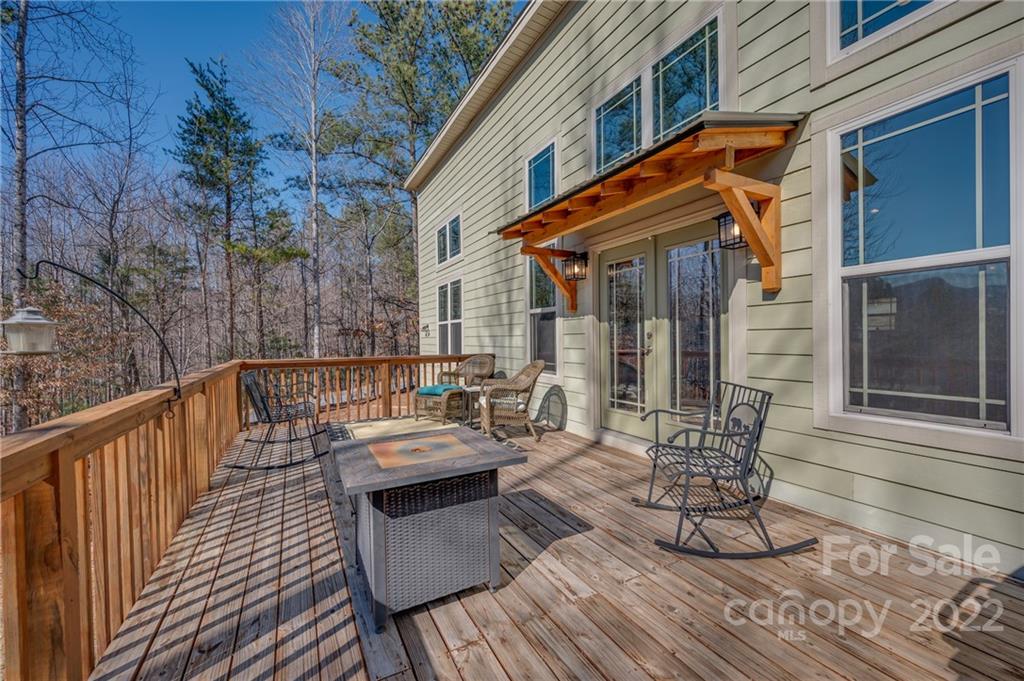 103 Christopher Road Tryon, NC 28782 - Photo 14 of 45 a view of balcony with chairs and wooden fence