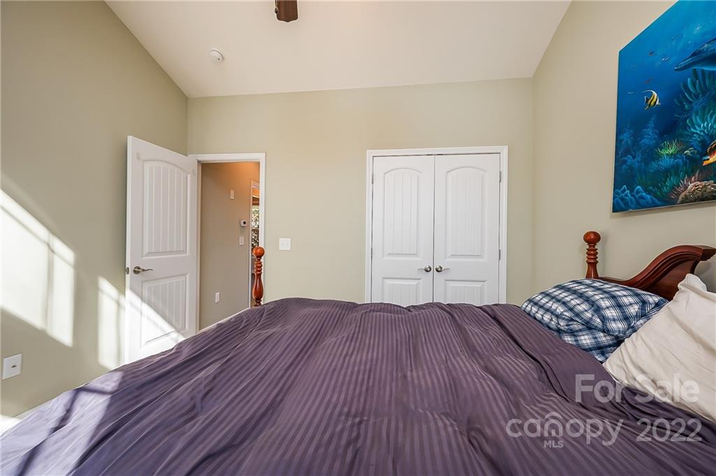 103 Christopher Road Tryon, NC 28782 - Photo 17 of 45 a bedroom with a bed and a window