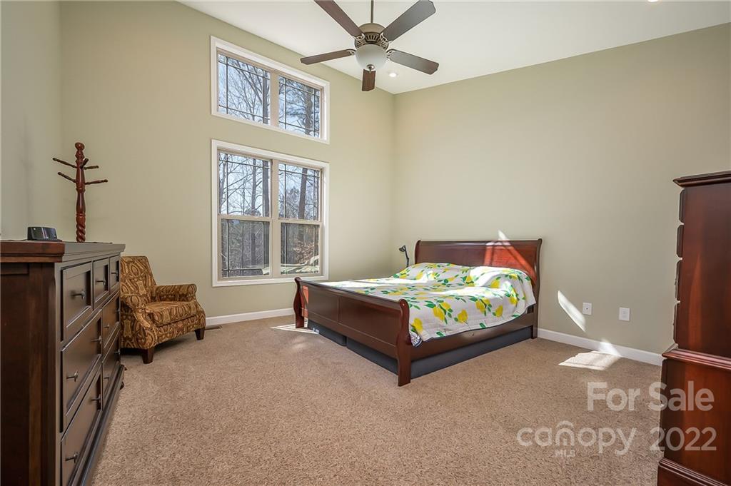 103 Christopher Road Tryon, NC 28782 - Photo 18 of 45 a bedroom with a bed and a couch