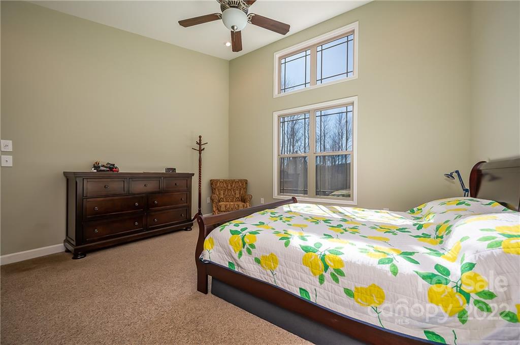 103 Christopher Road Tryon, NC 28782 - Photo 22 of 45 a bedroom with a bed and a dresser in it