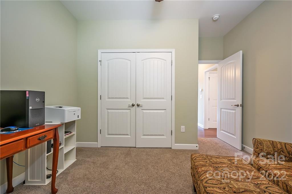 103 Christopher Road Tryon, NC 28782 - Photo 24 of 45 a bedroom with furniture and flat screen tv