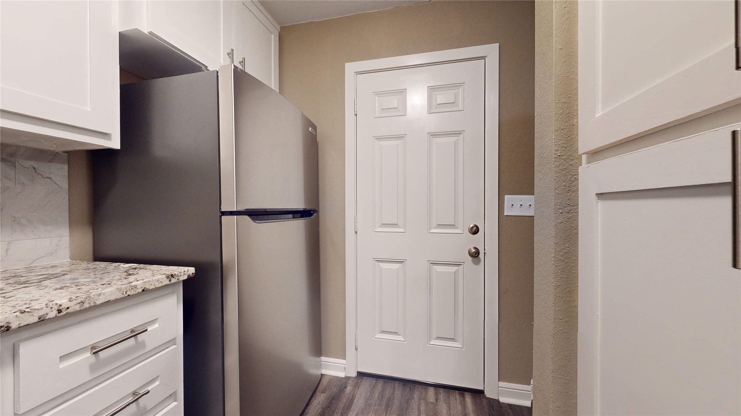 302 Georgia Street, Unit AB South Houston, TX 77587 - Photo 11 of 25 a kitchen with a refrigerator and cabinets