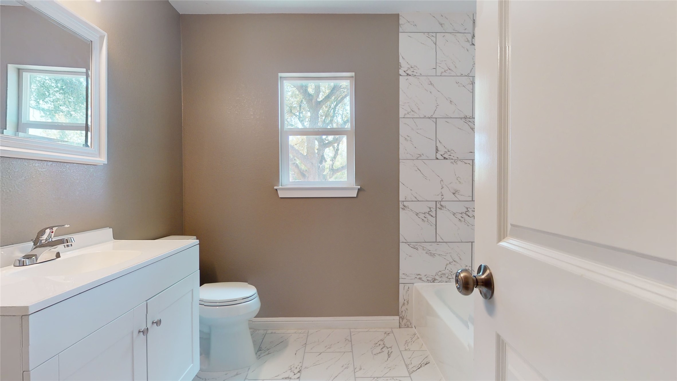 302 Georgia Street, Unit AB South Houston, TX 77587 - Photo 14 of 25 a bathroom with a sink toilet and shower