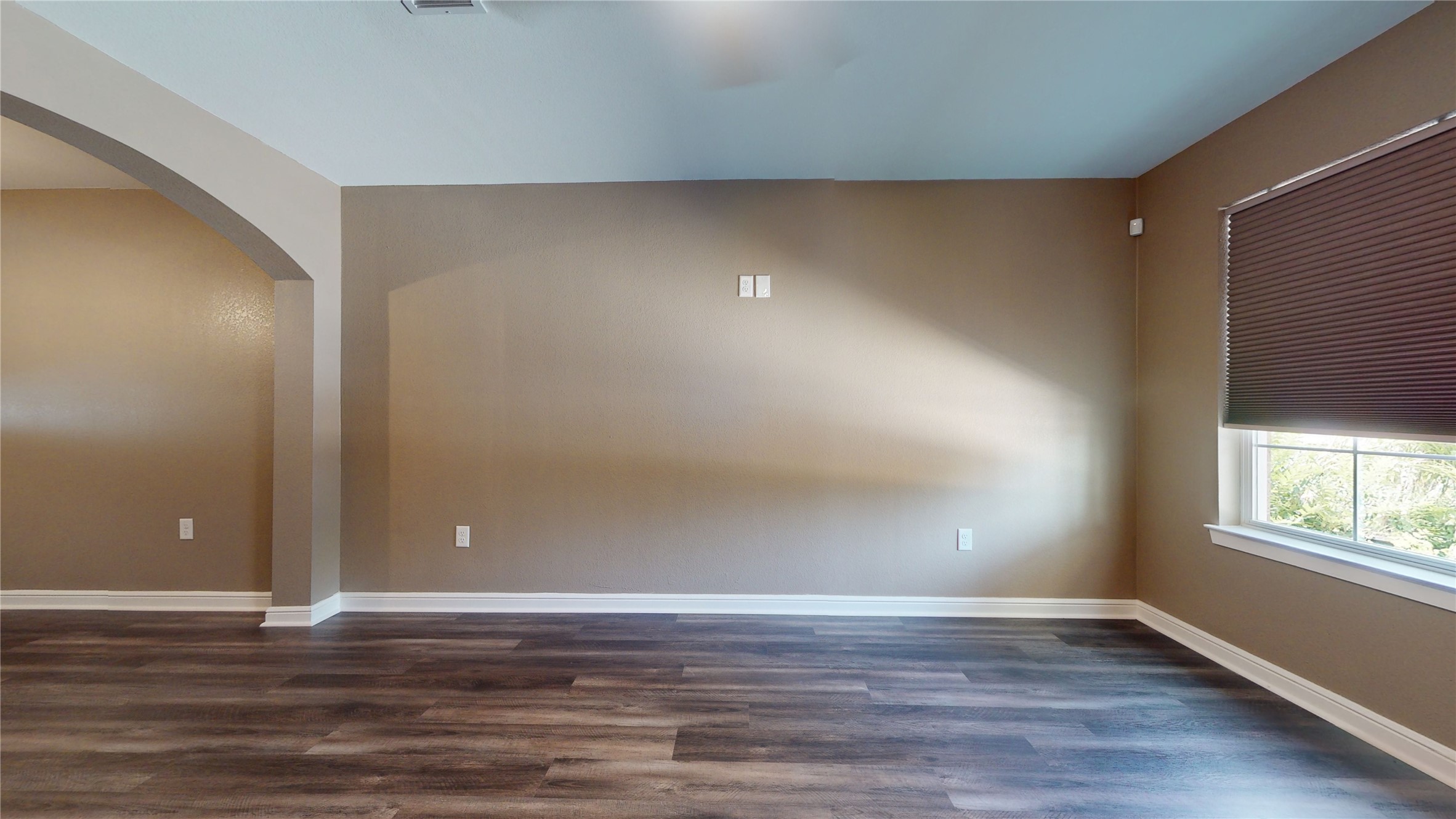 302 Georgia Street, Unit AB South Houston, TX 77587 - Photo 4 of 25 a view of an empty room with wooden floor and window