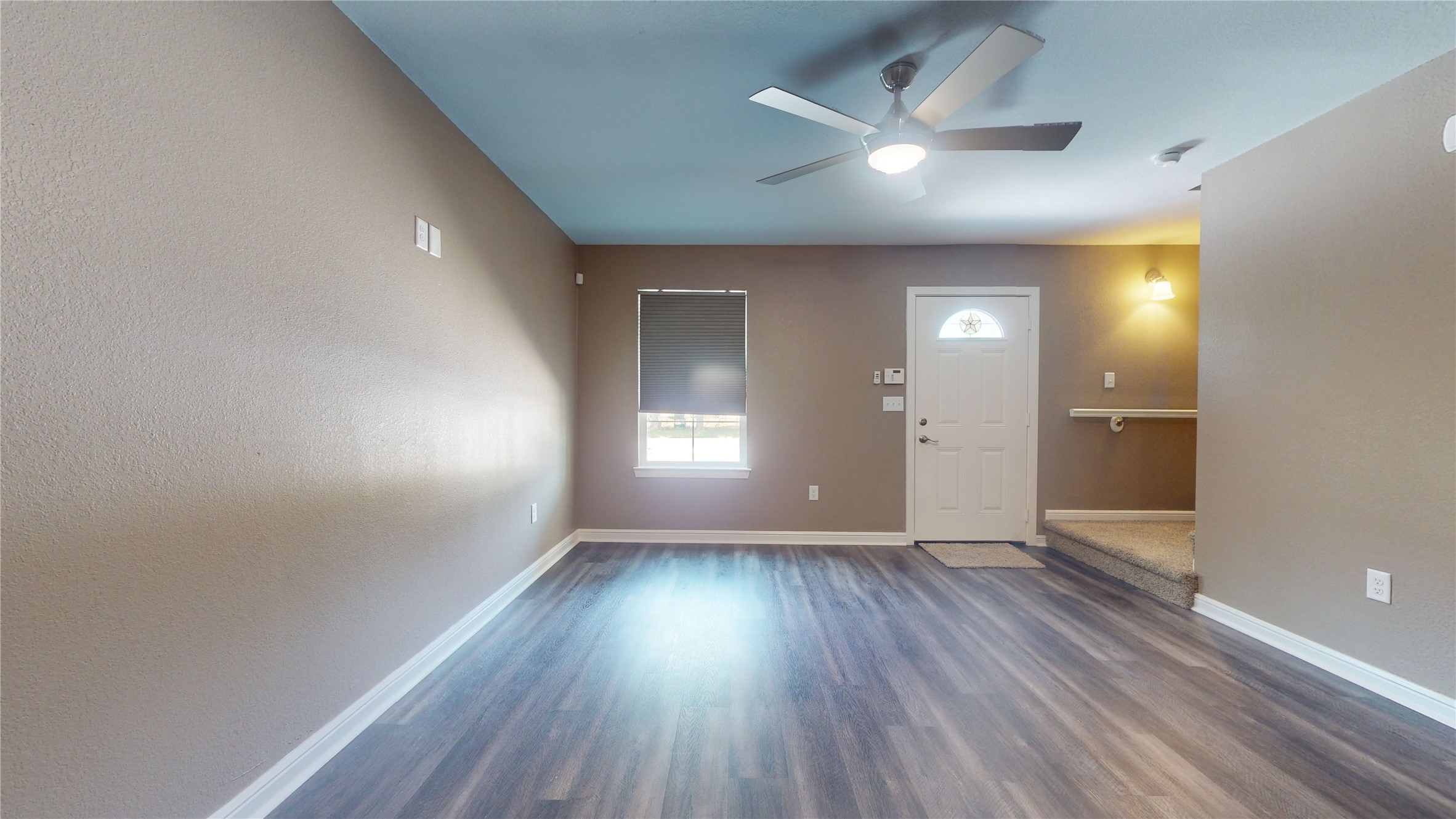 302 Georgia Street, Unit AB South Houston, TX 77587 - Photo 5 of 25 wooden floor in an empty room with a window