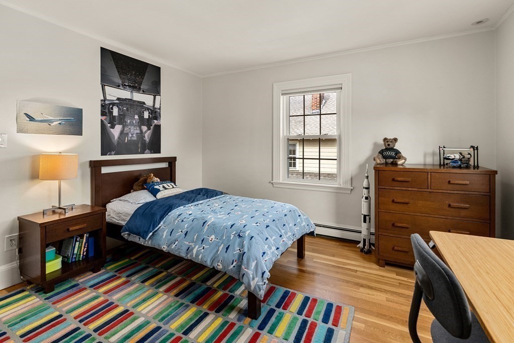 29 Louise Road Belmont, MA 02478 - Photo 14 of 17 a bedroom with a bed and wooden floor