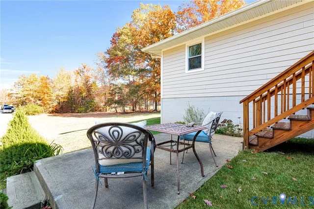 a view of a chairs and table in the patio