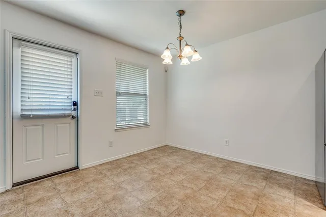 a view of a livingroom with a chandelier fan