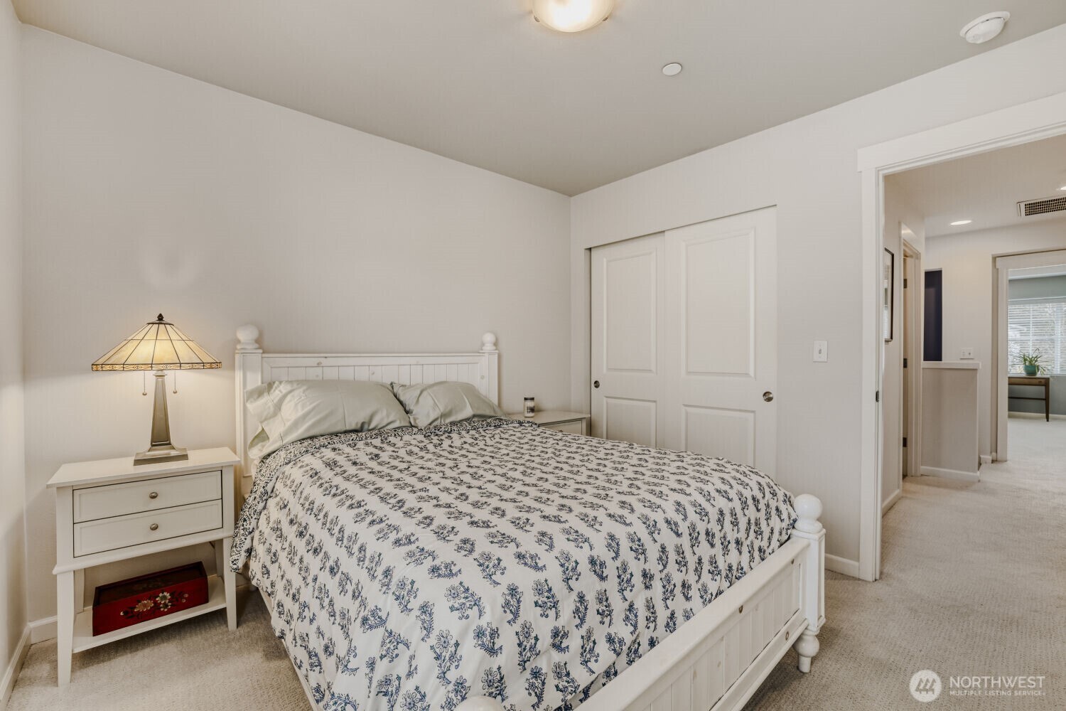18705 101st Avenue Northeast, Unit 3 Bothell, WA 98011 - Photo 19 of 31 a bedroom with a bed and a night stand
