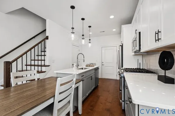 a kitchen with a sink and a refrigerator