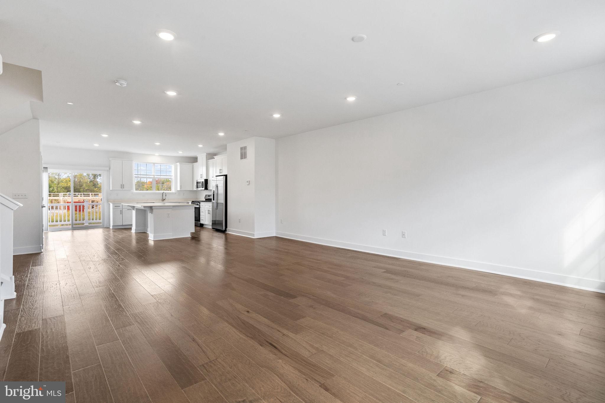 142 ADA Hightower Avenue Pennington, NJ 08534 - Photo 11 of 46 a view of an empty room with wooden floor