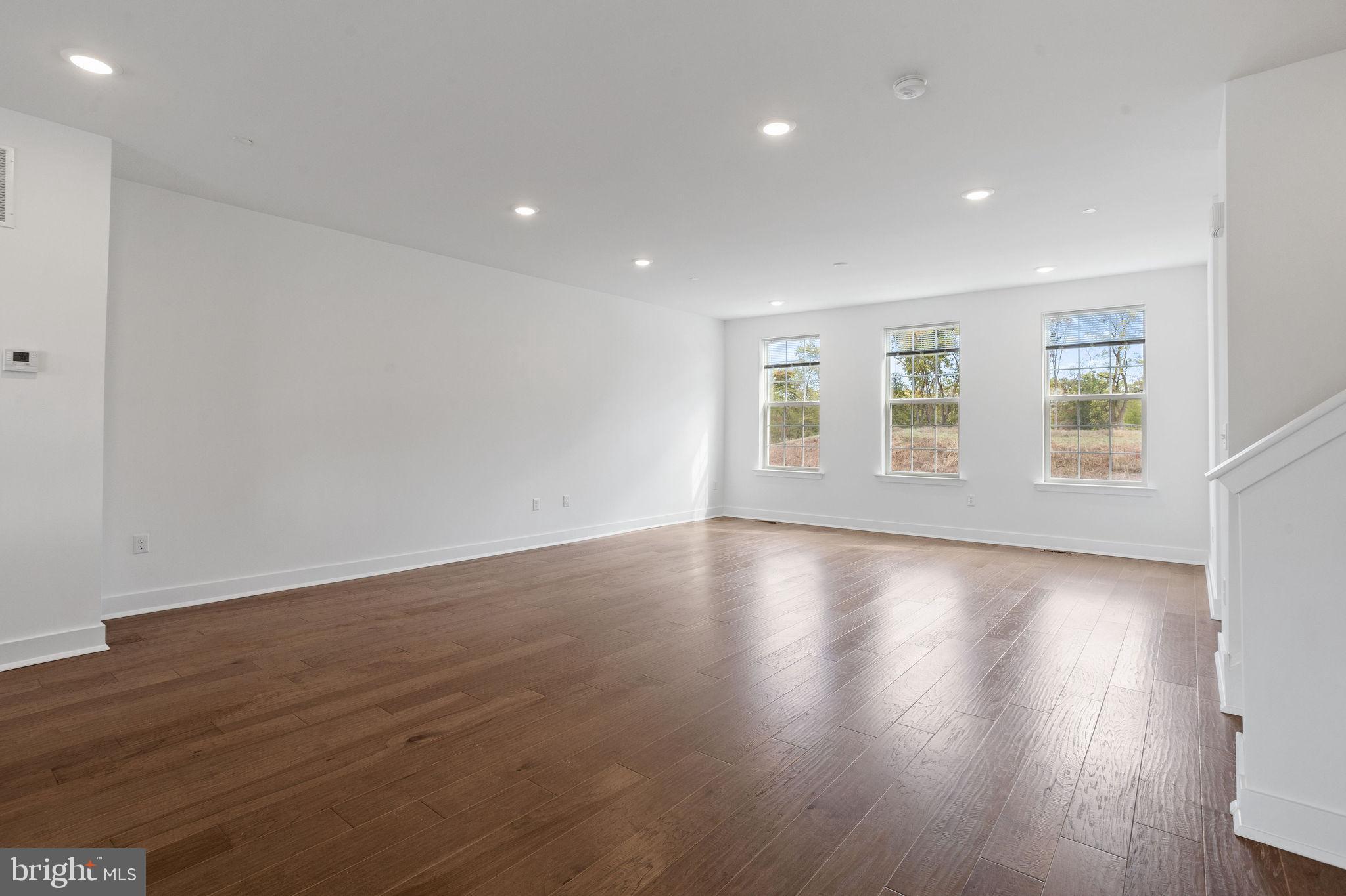 142 ADA Hightower Avenue Pennington, NJ 08534 - Photo 12 of 46 a view of empty room with wooden floor and fan