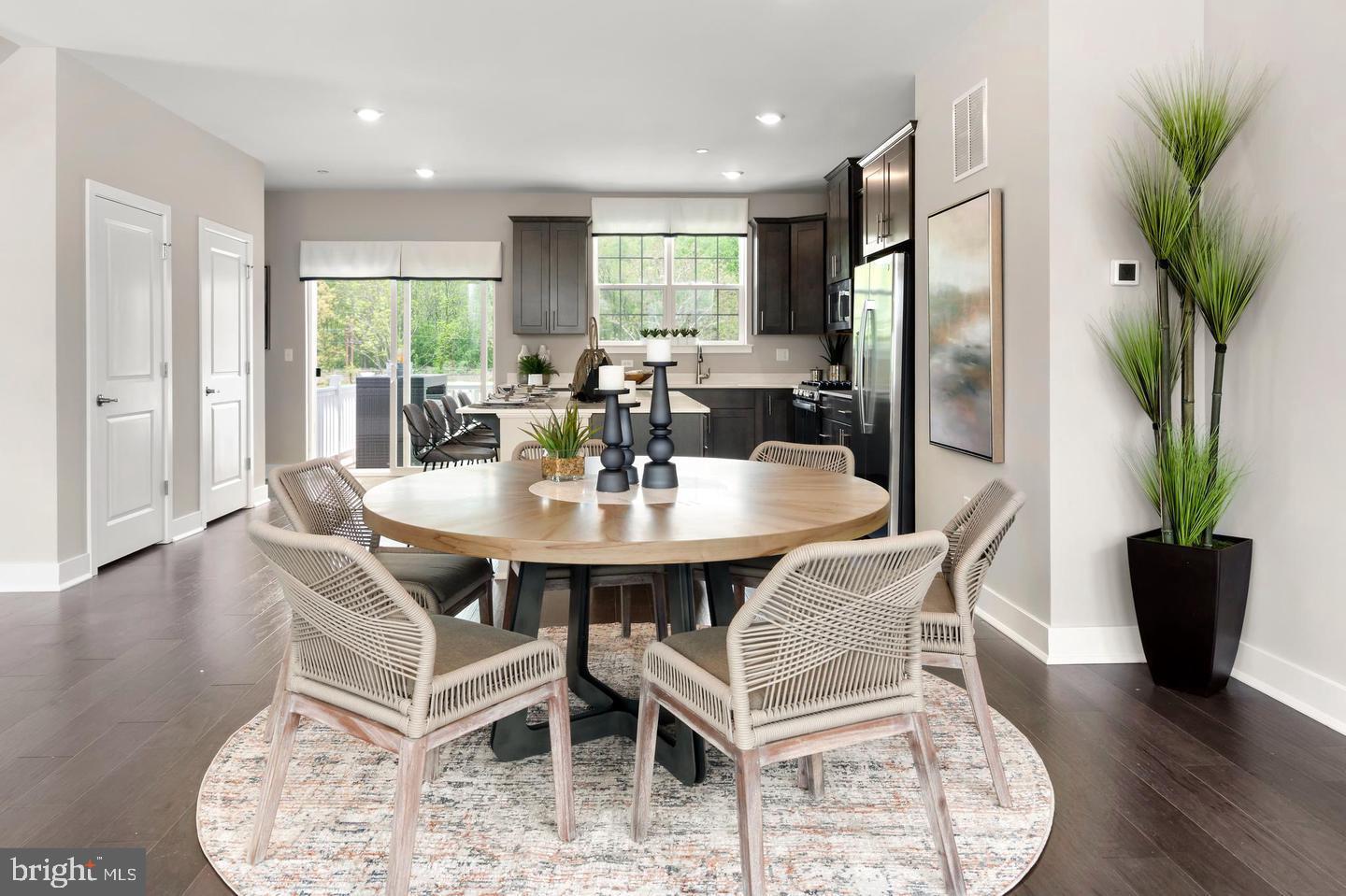 142 ADA Hightower Avenue Pennington, NJ 08534 - Photo 14 of 46 a view of a dining room with furniture and wooden floor