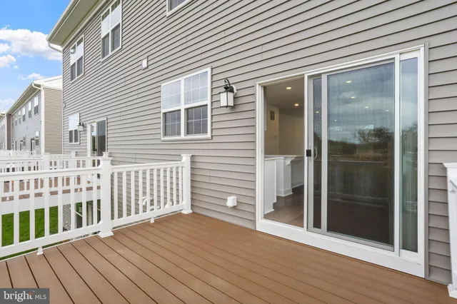 a view of a wooden house with a glass door