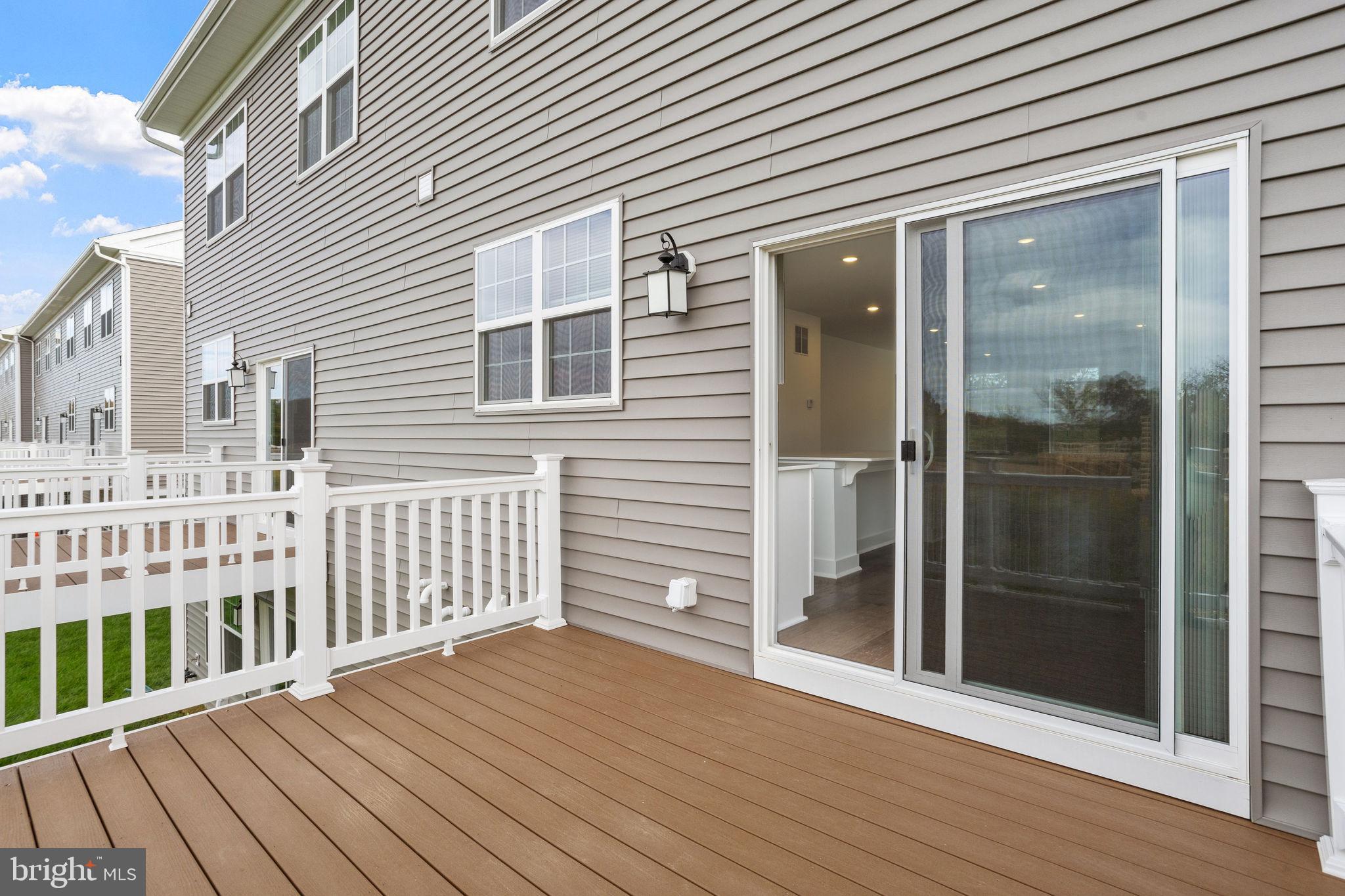 142 ADA Hightower Avenue Pennington, NJ 08534 - Photo 16 of 46 a view of a wooden house with a glass door