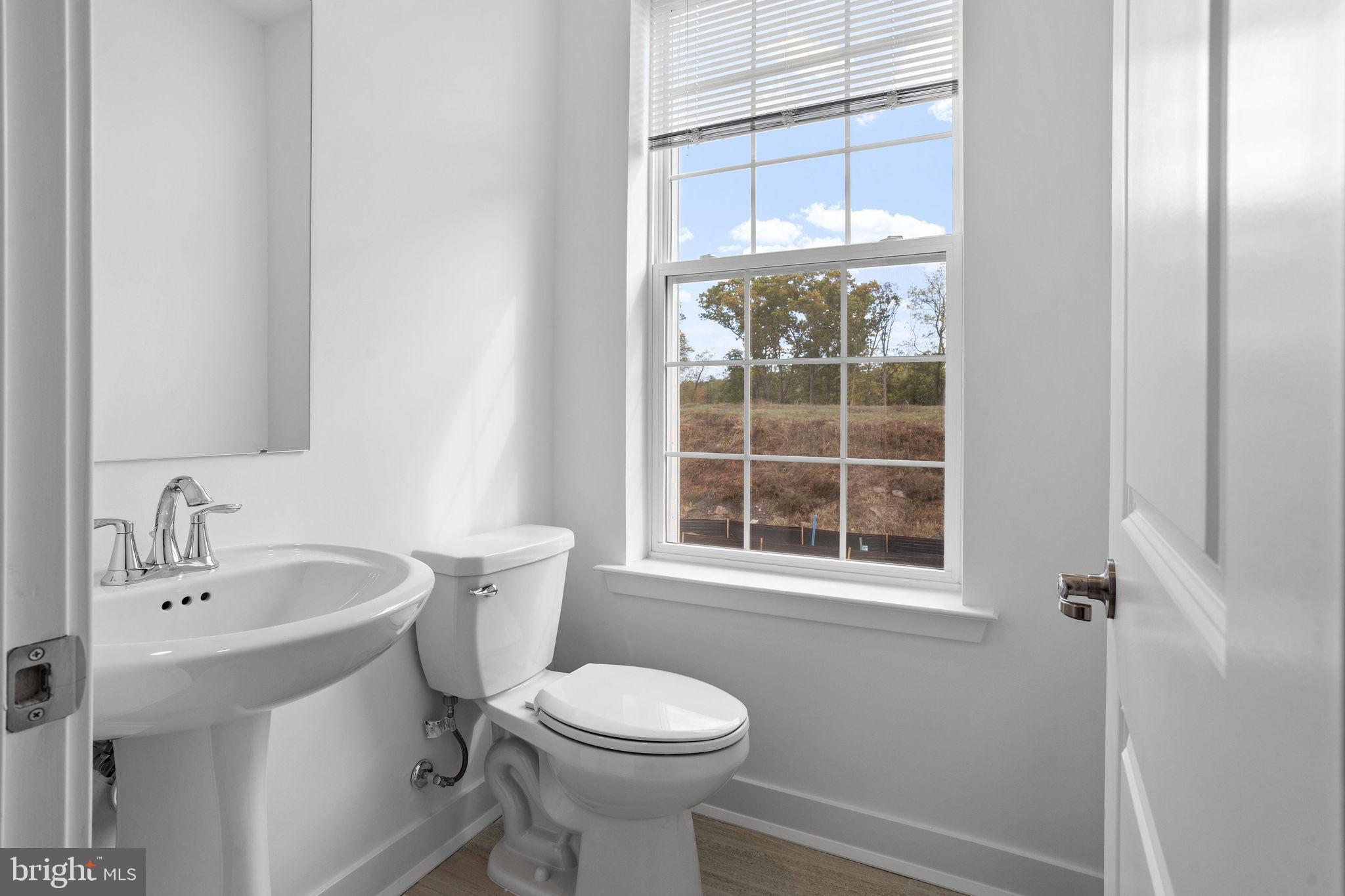 142 ADA Hightower Avenue Pennington, NJ 08534 - Photo 18 of 46 a bathroom with a sink and a toilet