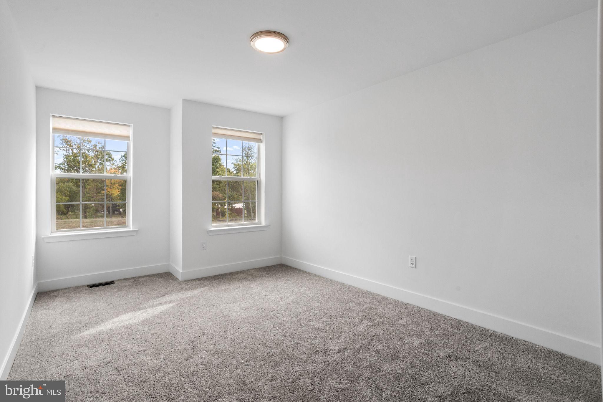 142 ADA Hightower Avenue Pennington, NJ 08534 - Photo 26 of 46 an empty room with windows