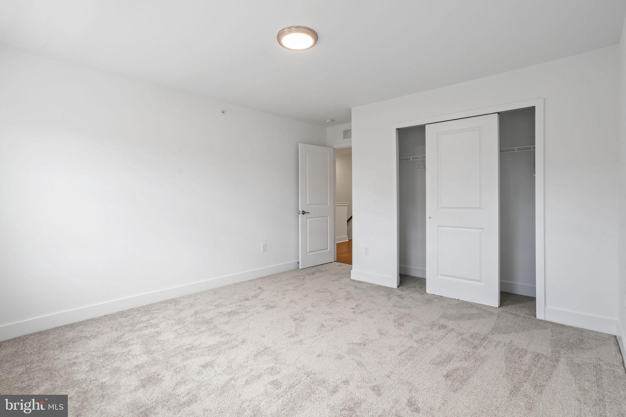 142 ADA Hightower Avenue Pennington, NJ 08534 - Photo 33 of 46 an empty room with an entryway