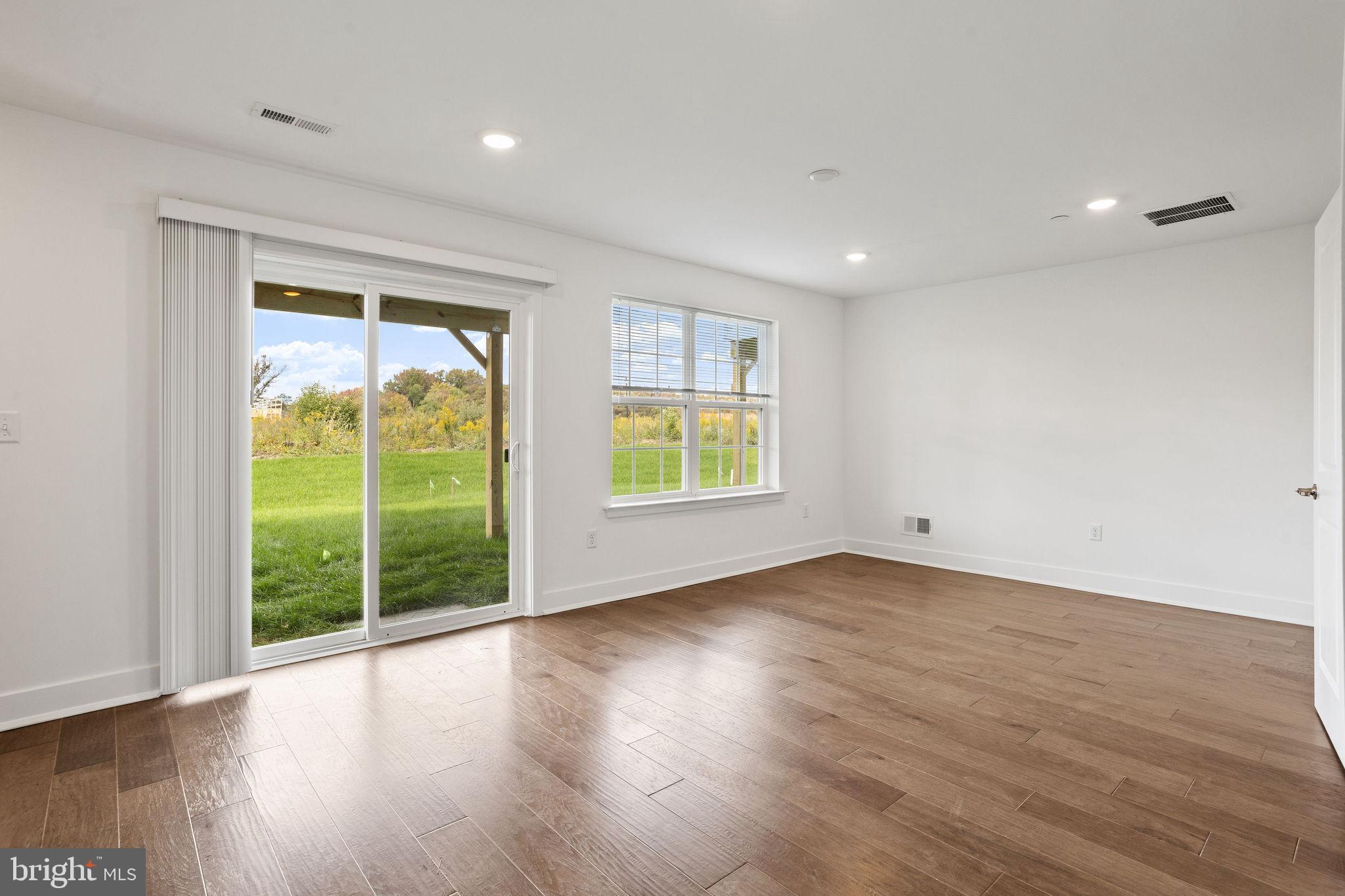 142 ADA Hightower Avenue Pennington, NJ 08534 - Photo 35 of 46 a view of an empty room with wooden floor and a window